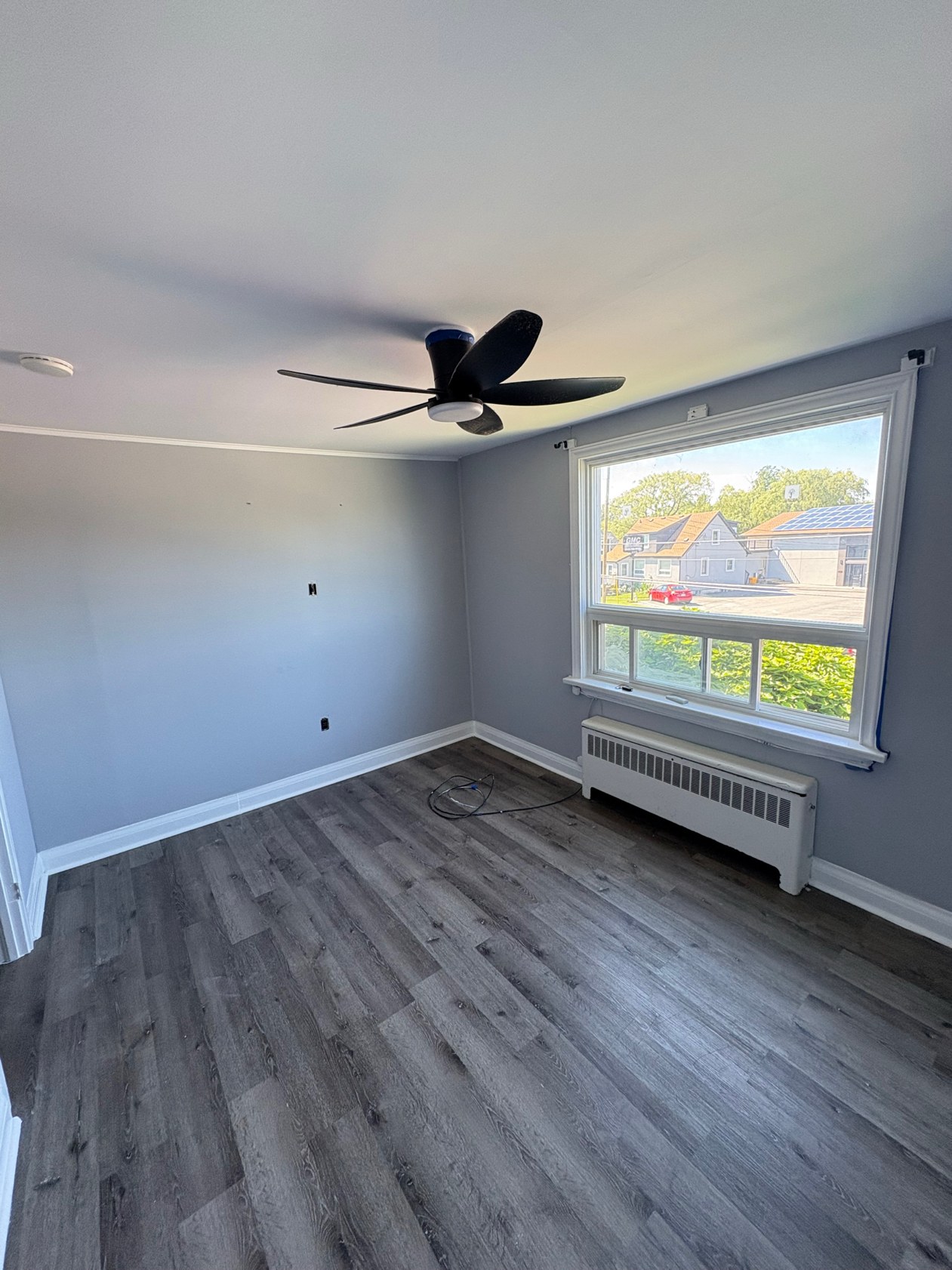 Bedroom after repaint, clean modern gray walls